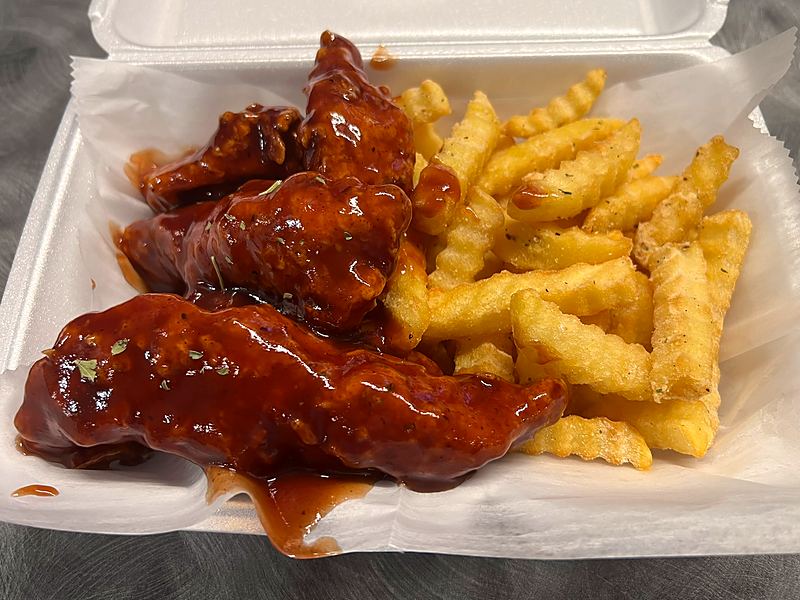 BBQ sauced chicken tenders with crinkle fries