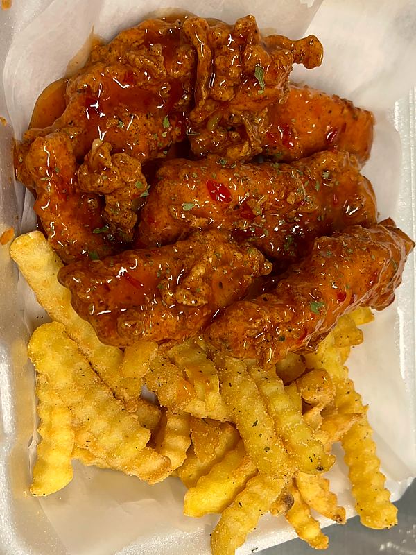 Sticky glazed chicken tenders over crinkle fries